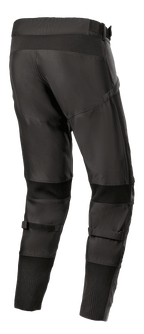Alpinestars T SP-5 Rideknit®-byxor, motorcykelbyxor i textil, svarta, vy bakifrån som visar hög ryggprofil och avsmalnande passform, stickade stretchpaneler bakom knän och vrister, justerbara remmar vid vaderna, prestandautrustning för vägkörning