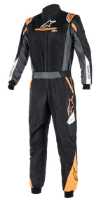 Alpinestars Atom FIA Graphic Suit, Black and Anthracite with Orange Fluo accents, one-piece FIA-certified auto racing suit, high collar, ASTARS branding on sleeves, professional motorsport and track competition gear