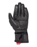 Alpinestars WT-4 GORE-TEX Isolerad Handske, motorcykelhandske, svart, vy av handflatan med läderkonstruktion och gummigrepp, mellanhög manschett med Alpinestars Exploration Equipment-märkning och röda logotypdetaljer