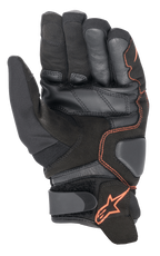 Alpinestars SMX-1 Drystar®-handskar, motorcykelhandskar, svart och röd fluo, vy av handflatan som framhäver förstärkt konstruktion i läder och mocka, vadderade landningszoner och kardborreband vid handleden med röd stjärnlogotyp.