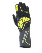 Alpinestars Tech-1 ZX V4 Gloves, Auto Racing Gloves, Tar Gray, Black and Yellow Fluo, featuring a large yellow star logo on the back and white branding on the cuff, honeycomb textured fabric with angular neon accents, professional motorsport gear.