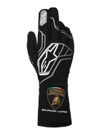 Alpinestars Limited Edition Lamborghini Tech-1 ZX V4 handskar, svarta med mörkgrå och vita detaljer, med den framträdande Alpinestars-logotypen och Automobili Lamborghini Squadra Corse-skölden på mudden, professionella FIA-certifierade racinghandskar