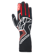 Alpinestars Tech-1 Race V4 Gloves, Auto Racing Gloves, Black with Red and White accents, featuring a large white star logo on the backhand, red finger gussets, white branding on the extended gauntlet cuff, and geometric design patterns.