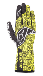 Alpinestars Tech-1 K Race V2 Vertical Gloves, Karting Racing Gloves, Yellow Fluo and Black, featuring a white star logo, intricate abstract line pattern, and ASTARS branding on the cuff, lightweight design for motorsport performance
