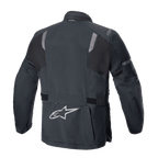 Alpinestars ST-7 2L GORE-TEX-jacka, baksida, svart och mörkgrå, med reflekterande axelpaneler, silverfärgad Alpinestars-stjärnlogotyp på nedre delen av ryggen och justerbara midjeremmar, motorcykelutrustning för äventyrstouring