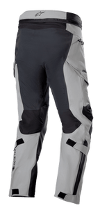 Alpinestars Boulder 3L GORE-TEX Pants, Adventure Motorcycle Pants, Dark Gray and Black, rear three-quarter view showing reinforced seat and inner legs, light gray panels, GORE-TEX logo on calf, and ergonomic cargo pockets.
