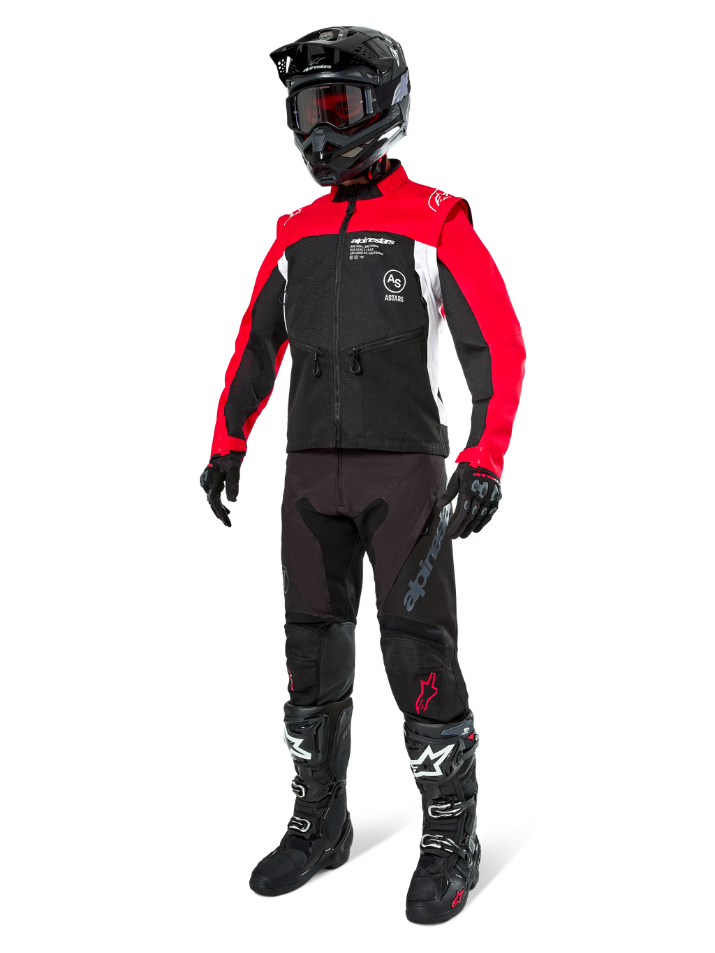 Alpinestars Pro-Dura jacka, offroad-motorcykeljacka, svart, klarröd och vit, bärs med komplett racingutrustning inklusive svart hjälm med röda goggles, svarta byxor samt svarta och vita stövlar, slitstark textiloutfit för enduro- och trailkörning