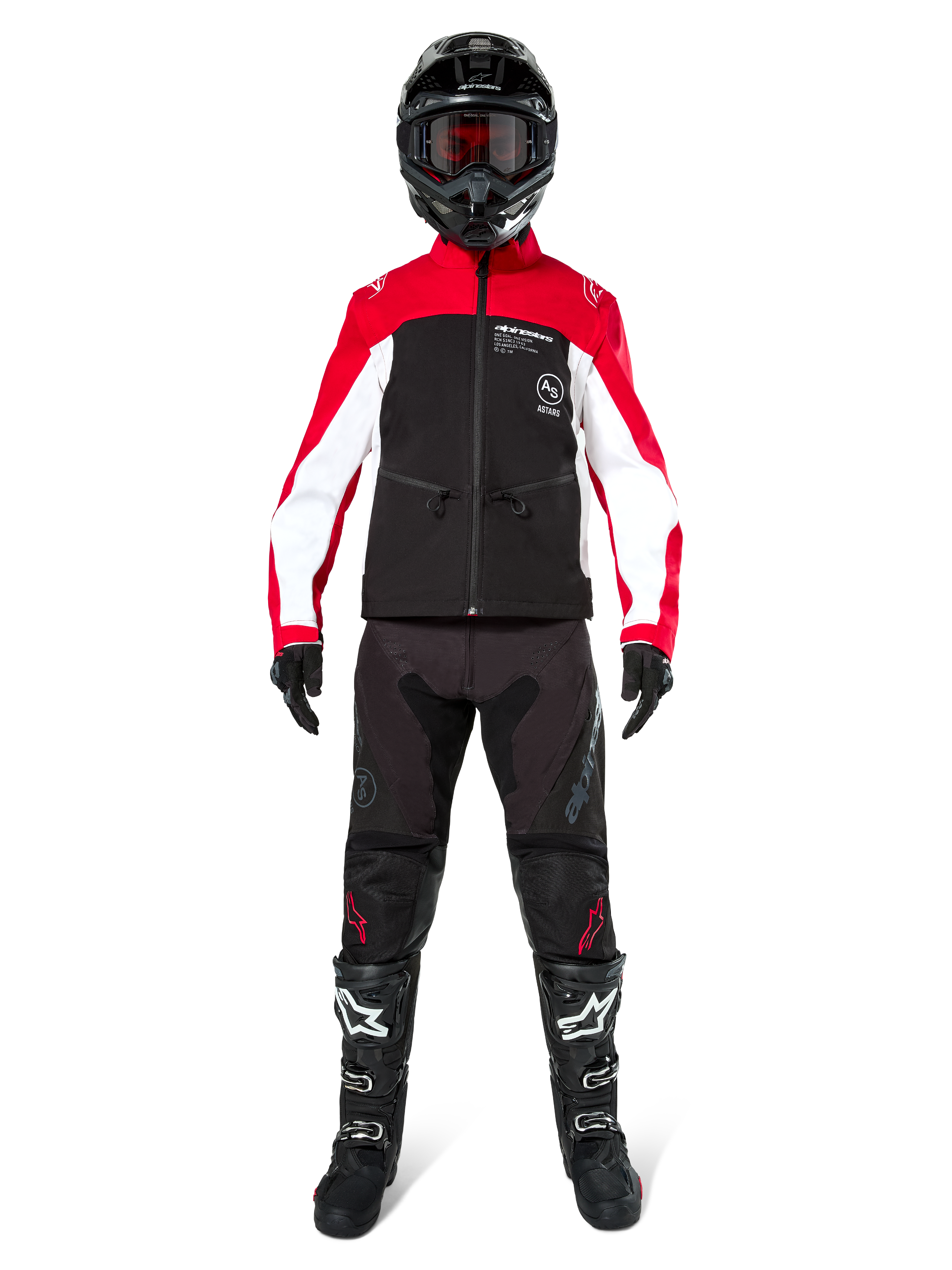 Motocross rider wearing the Alpinestars Lite-Dura Softshell Jacket in Black, Bright Red, and White, coordinated with black off-road pants, black and white boots, and a black helmet with goggles, complete gear setup for enduro racing