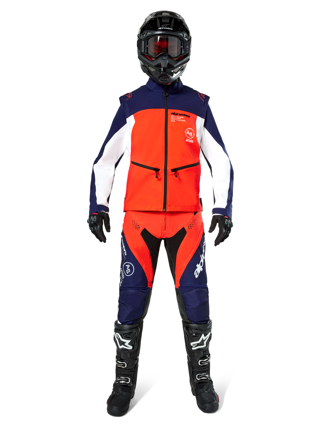 Motocross rider wearing complete off-road gear, Lite-Dura Softshell Jacket in Navy Hot Orange and White, matching navy and orange pants, black helmet with goggles, black and white boots, black gloves, coordinated outfit for enduro racing