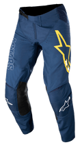 Alpinestars Techstar Phantom byxor, motocrossbyxor, mörkblå med gula och vita detaljer, svarta knäpaneler i läder, stor gul stjärnlogotyp på låret, vit ASTARS-logotyp, hållbart ripstop-tyg med stretch för terrängkörning