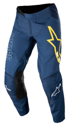 Alpinestars Techstar Phantom byxor, motocrossbyxor, mörkblå med gula och vita detaljer, svarta knäpaneler i läder, stor gul stjärnlogotyp på låret, vit ASTARS-logotyp, hållbart ripstop-tyg med stretch för terrängkörning