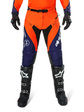 Alpinestars Pro-Dura Pants, Motocross and Enduro Pants, Navy Hot Orange and White, featuring black panels and white logos, worn with black off-road boots and gloves, professional protective gear for trail and off-road riding