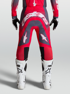 Alpinestars Supertech Hiten AFD Pants, professional motocross racing gear in Red Fluo and Graystone with white logos.