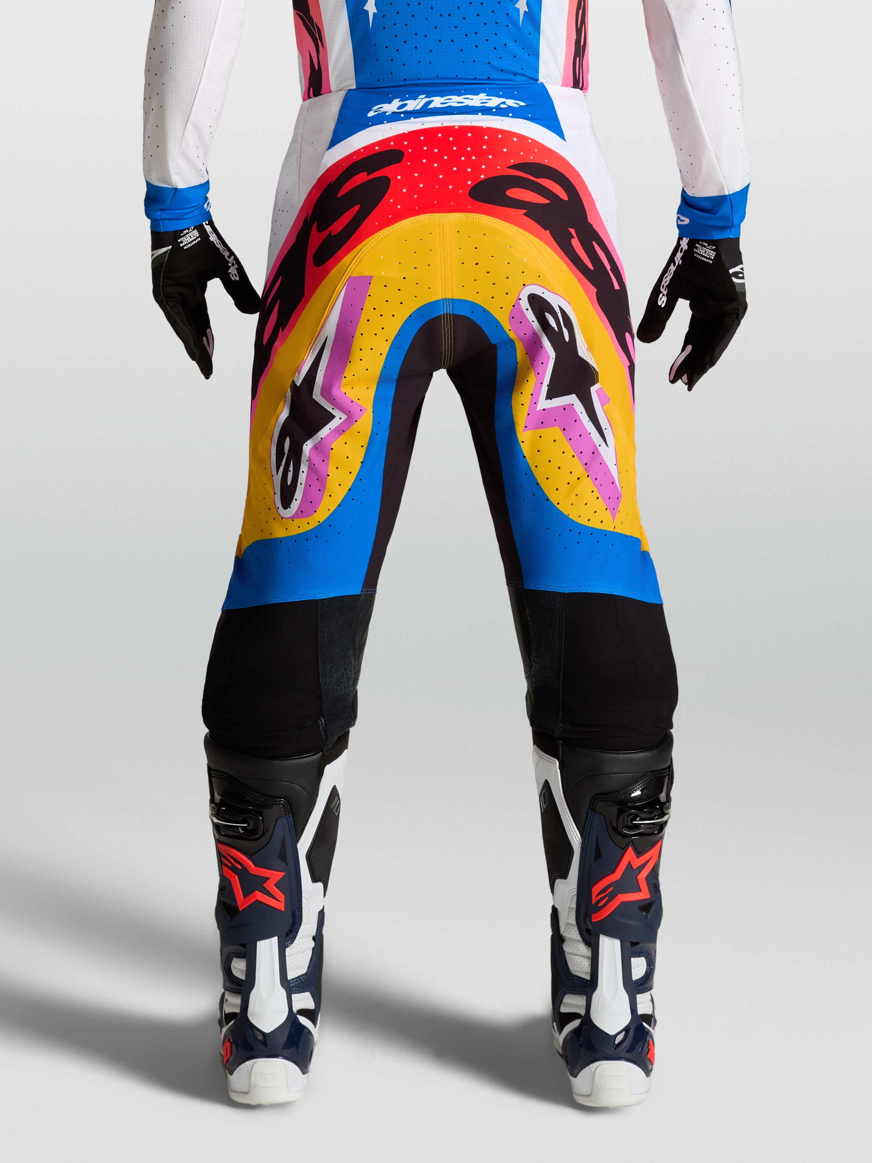 Alpinestars Supertech Dyna Pants, Motocross Racing Pants, Blue and Yellow multi-color design, lightweight stretch rip-stop material on-model.
