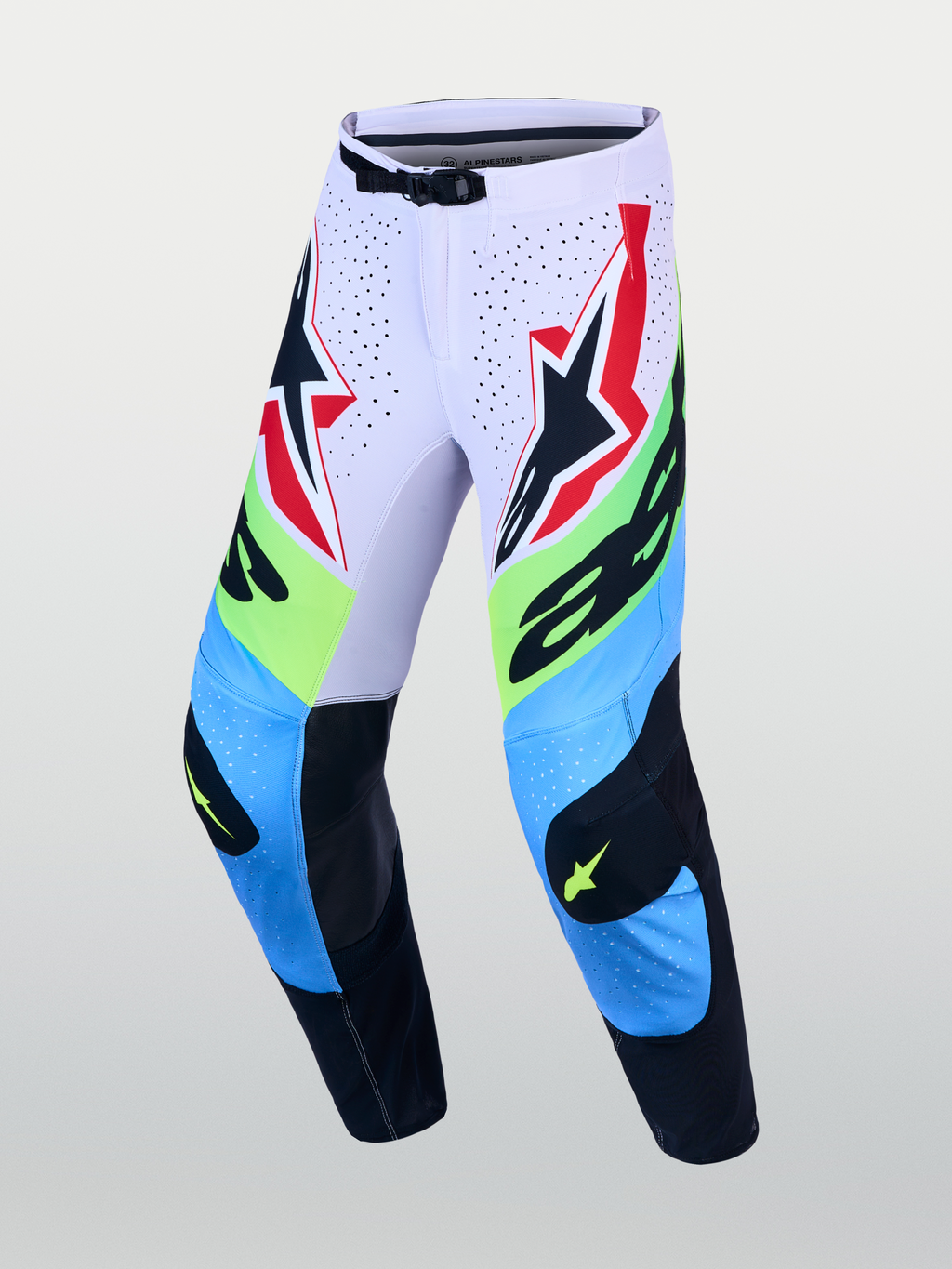 Alpinestars Supertech Dyna byxor, motocrossbyxor i ljuslila, blått och neongrönt med skyddande läderpaneler på knäna.