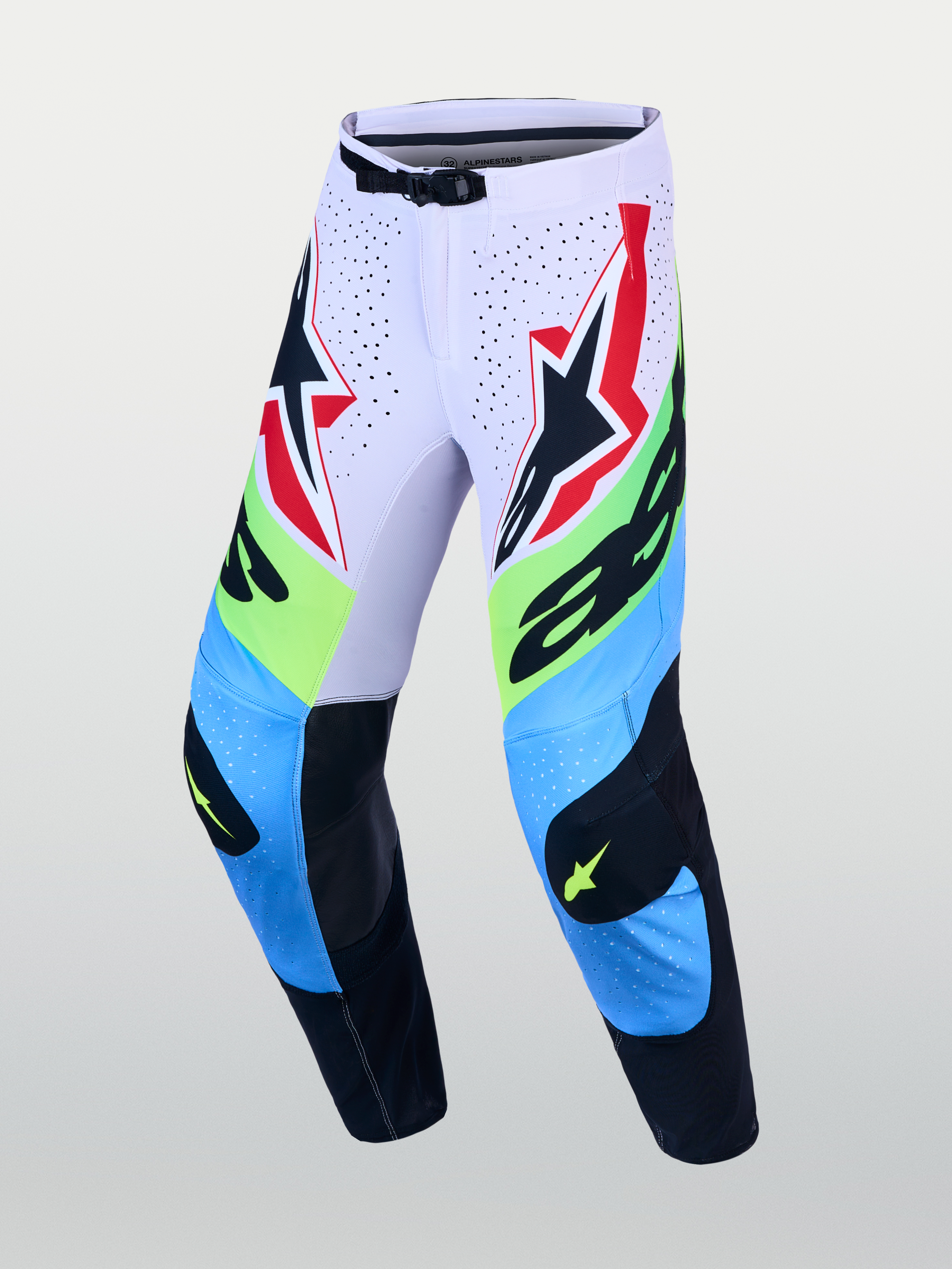 Alpinestars Supertech Dyna byxor, motocrossbyxor i ljuslila, blått och neongrönt med skyddande läderpaneler på knäna.