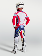 Alpinestars Supertech Dyna Pants, Men's Motocross Gear in Fire Red and Navy Blue, lightweight athletic fit on model.