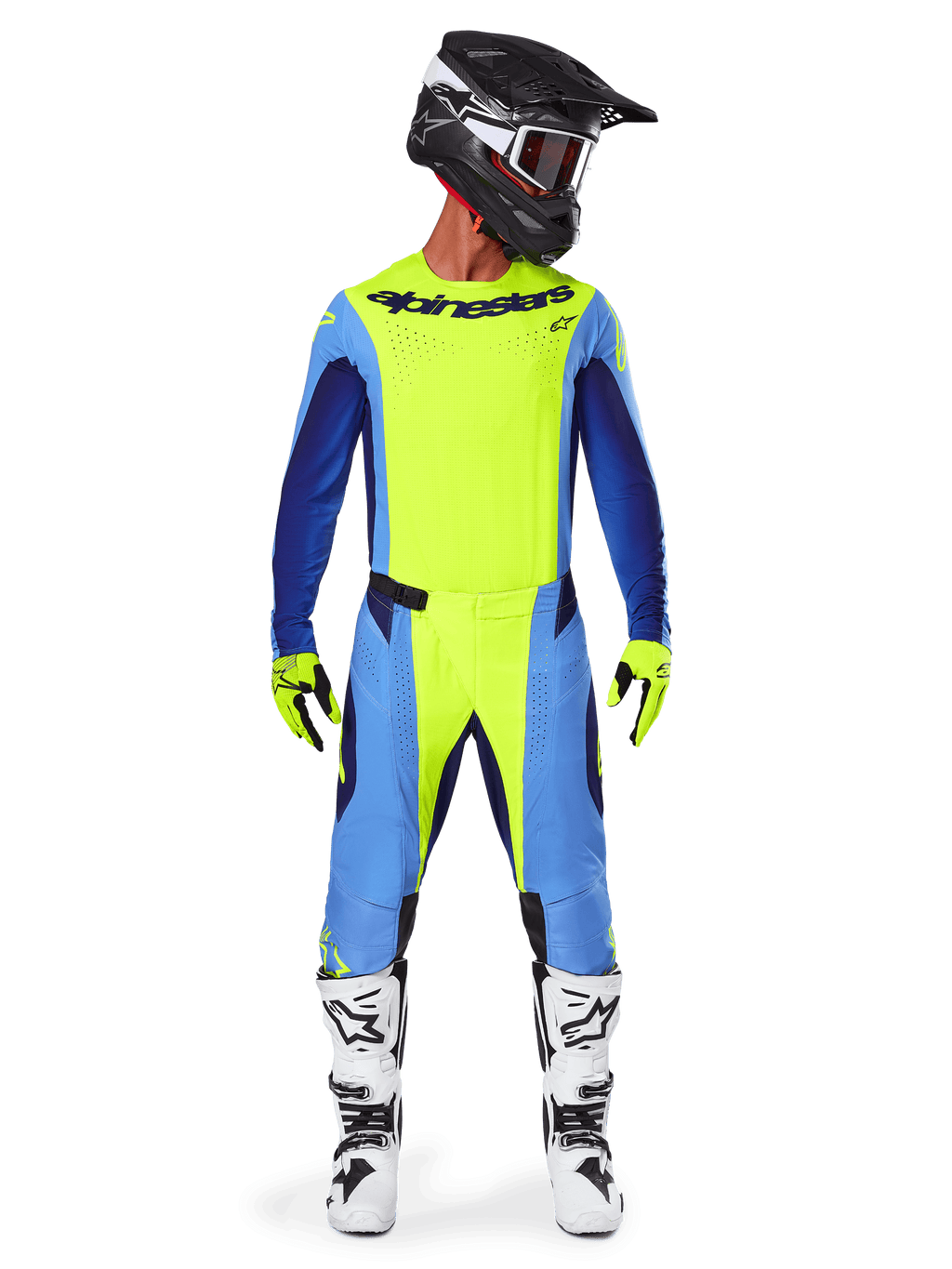 Motocrossförare klädd i Alpinestars 2025 Techstar Melt Gear Set, neongul tröja med blå och marinblå ärmar, matchande gula och blå byxor, svart och vit hjälm med goggles, vita och svarta stövlar, gula och svarta handskar, koordinerad outfit för terrängkörning