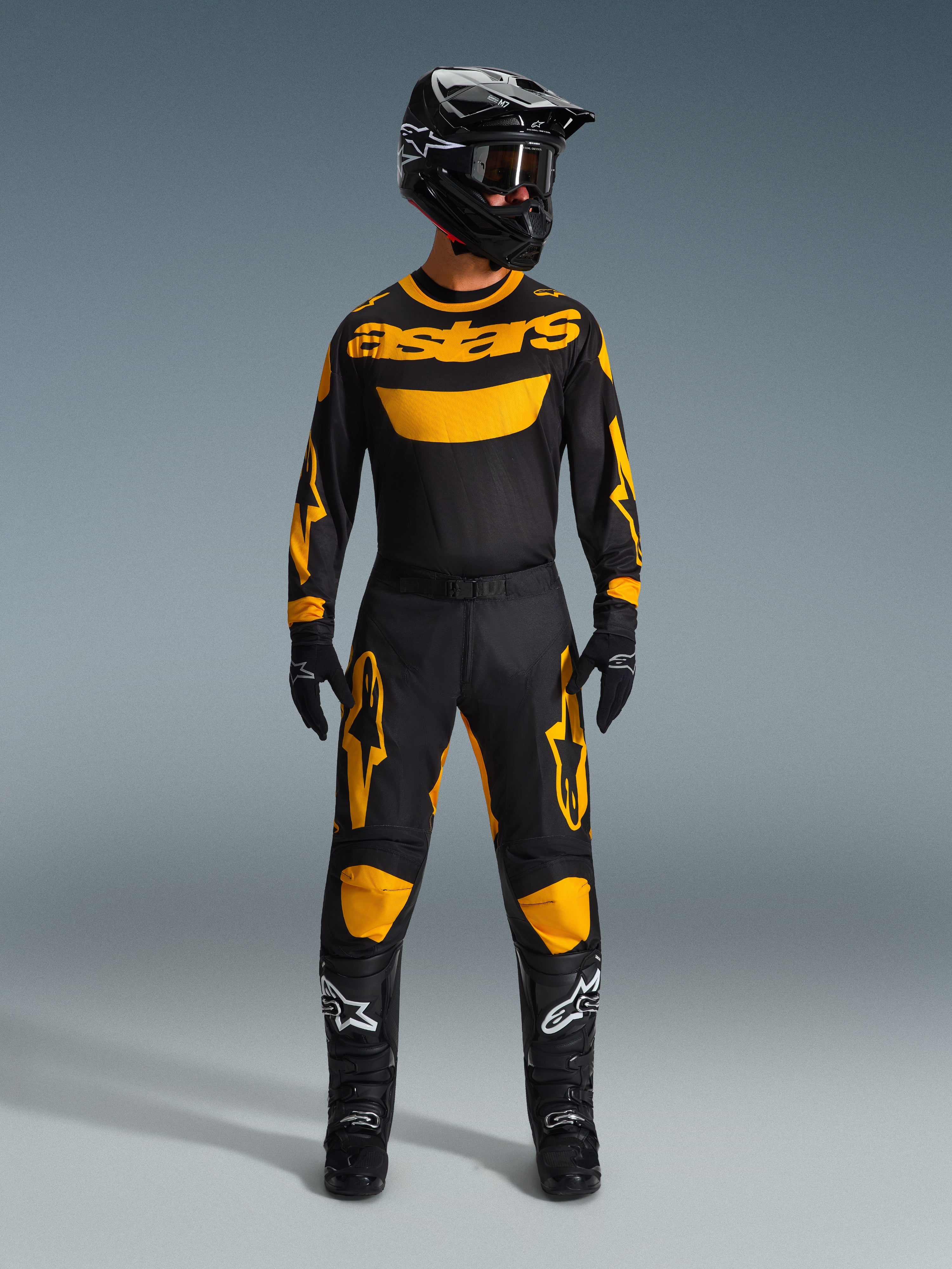 Alpinestars 2026 Racer Riway Gear Set, complete motocross racing outfit, black jersey with yellow astars branding, black pants with yellow knee and thigh accents, matching black helmet, goggles, gloves and boots, professional off-road apparel