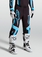Alpinestars Supertech Vesta byxor, motocrossbyxor för herr, svarta och turkosa, atletisk passform i stretch-ripstop med knäpaneler i läder och matchande racingutrustning.