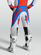 Alpinestars Supertech Vesta byxor, motocrossbyxor i rött, blått och vitt, perforerat stretch-ripstop-tyg för terrängkörning.