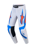 Alpinestars Supertech Vesta motocrossbyxor för herrar, vita, ljuslila och röda med perforerade paneler för terrängkörning.