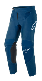 Alpinestars Supertech Blaze-byxor, motocross- och off-roadbyxor, mörkblå med svarta knäpaneler i läder, vita Alpinestars-logotyper på lår och ben, justerbart midjespänne och ventilationszoner i mesh vid höfterna.