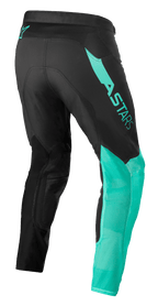 Alpinestars Supertech Blaze byxor, motocrossbyxor, svart och pastellgrön, trekvartsvy bakifrån som visar ASTARS-branding på låret, ventilerande mesh på underbenen och stretchmaterial för ergonomisk prestanda
