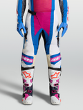 Alpinestars 2027 Techstar Maven byxor, vita och blå motocrossbyxor med korallrosa detaljer och knäpaneler i läder.