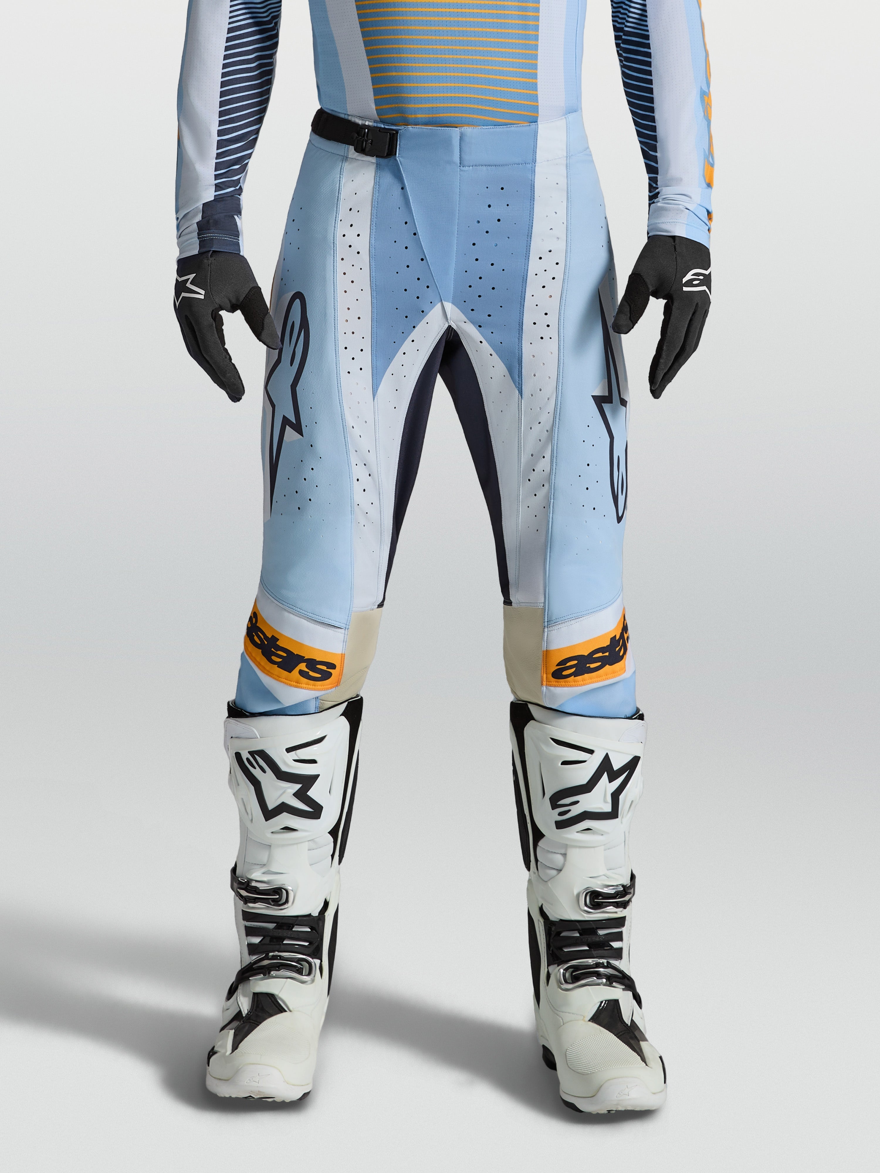 Alpinestars Techstar Maven Pants, Men's Motocross Gear in Blue and Orange with laser-cut ventilation and ergonomic race fit.