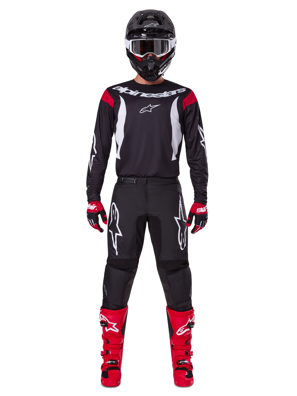 Alpinestars 2025 Fluid Haul utrustningsset, motocrossförare i komplett racingutrustning, svart tröja med röda axeldetaljer och vita logotyper, svarta byxor med vit stjärnlogotyp, klarröda stövlar, röda och svarta handskar, svart hjälm med vita goggles, koordinerad outfit för terrängkörning