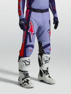 Alpinestars Racer Air Hunt Pants, ventilated purple and pink motocross gear shown on-model with white boots.