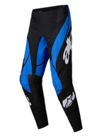Alpinestars 2025 Techstar Dreem-byxor, motocrossbyxor, svarta och blå med vita Alpinestars-logotyper, distinkta kantiga blå paneler på svart bas, atletisk design med förstärkta knäpartier för terrängkörning.