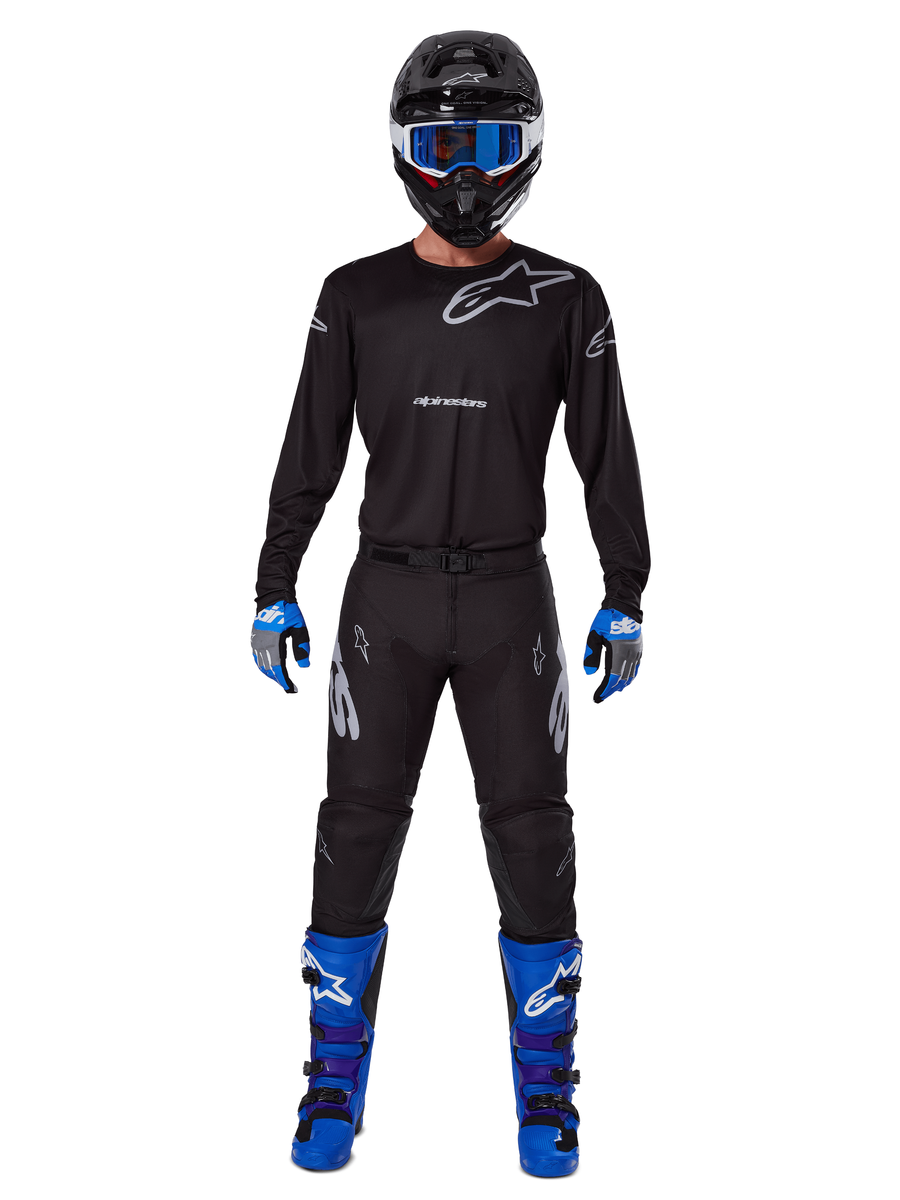 Alpinestars 2025 Racer Graphite Pants, Motocross Pants, Black and Gray, worn on a model with a matching black jersey, blue and purple boots, and blue goggles, complete off-road racing outfit featuring bold Alpinestars branding