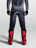 Alpinestars Racer Amber byxor, herrmotocrossbyxor i gråa nyanser, vy bakifrån, slitstarkt 600D-polytyg.