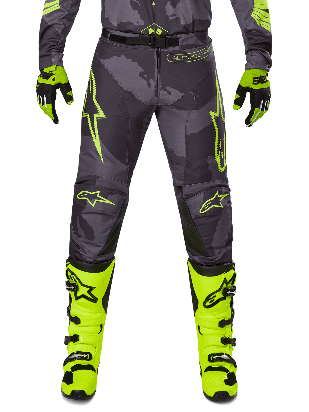 Alpinestars 2025 Racer Hollow Pants, motorcykelbyxor för motocross, mörkgrå med neongula detaljer, gula stjärnlogotyper, kombinerad med neongula stövlar och svarta handskar, skyddande sportdesign