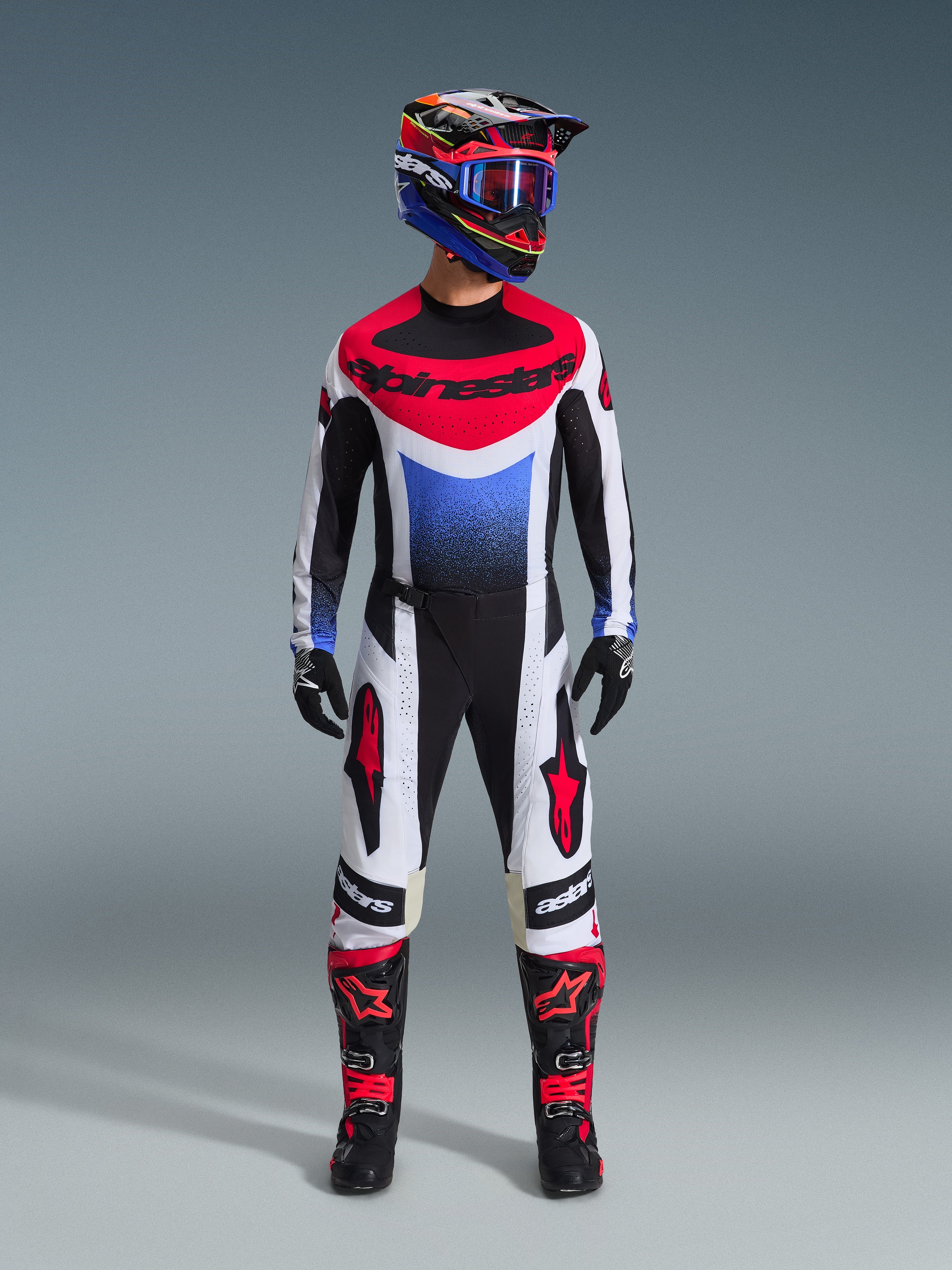 2026 Techstar Knif Gear Set, Motocross Outfit, Red White and Blue Jersey with Alpinestars logo, matching White and Black Pants with Red details, Colorful Racing Helmet with Blue Goggles, Black Boots with Red accents, complete MX racing kit