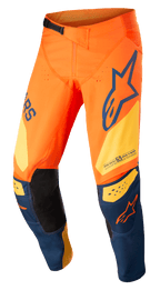 Alpinestars Techstar Factory-byxor, motocrossbyxor, orange och mörkblå med varmgula detaljer, framträdande logotyper, 3D Babel-knäkonstruktion med svarta läderpaneler på insidan och ett justerbart midjespänne för terrängkörning.