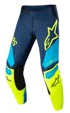 Alpinestars Techstar Factory-byxor, motocrossbyxor för racing, mörkblå, neongula och ljusblå, med svarta innerpaneler vid knäna, gul stjärnlogotyp på låret, "ONE GOAL ONE VISION"-grafik och perforerade ventilationszoner för högpresterande terrängkörning