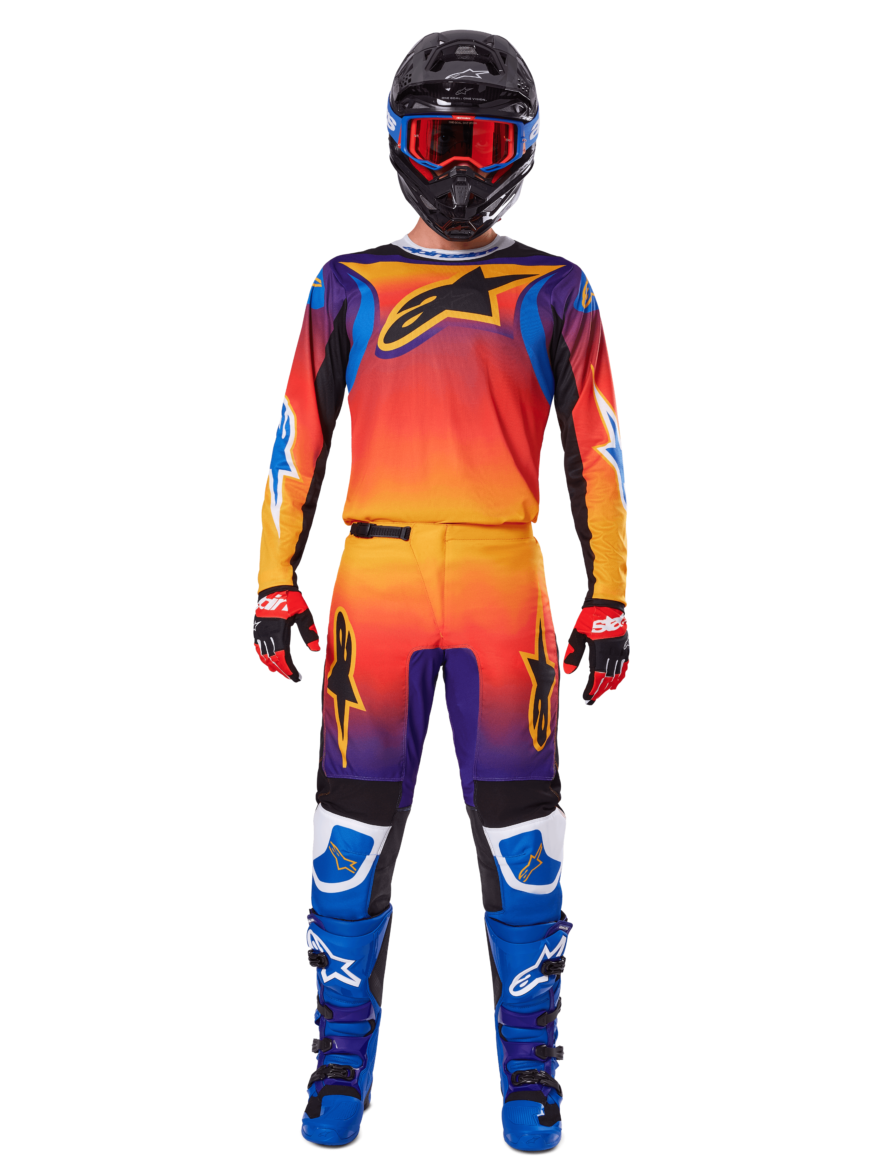 Alpinestars 2025 Fluid Wurx-byxor, motocrossbyxor, flerfärgad orange, gul och lila gradient, bärs med matchande tröja, svart hjälm med blå goggles, röda och svarta handskar och blå stövlar, koordinerad motocrossutrustning