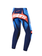 Alpinestars Techstar Nomur-byxor 2026, motocrossbyxor, mörkblå, orange och UCLA-blå, vy bakifrån med en framträdande vit astars-logotyp på en orange panel, flerpanelsdesign med ljusblå accenter, svarta innerpaneler vid knäna, hållbar utrustning för terrängkörning