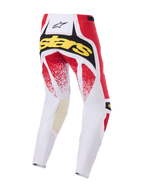 Alpinestars 2026 Techstar Nomur-byxor, motocrossbyxor, vita, röda och svarta, baksida med gul 'Stars'-logotyp och röd spräcklig grafik, hållbar konstruktion med flera paneler för terrängkörning