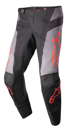 Alpinestars 2023 Techstar Sein byxor, motocrossbyxor, svarta och grå med neonröd stjärngrafik, perforerade ventilationszoner, magnetiskt midjespänne, förstärkt 3D Babel-knäkonstruktion för terrängkörning