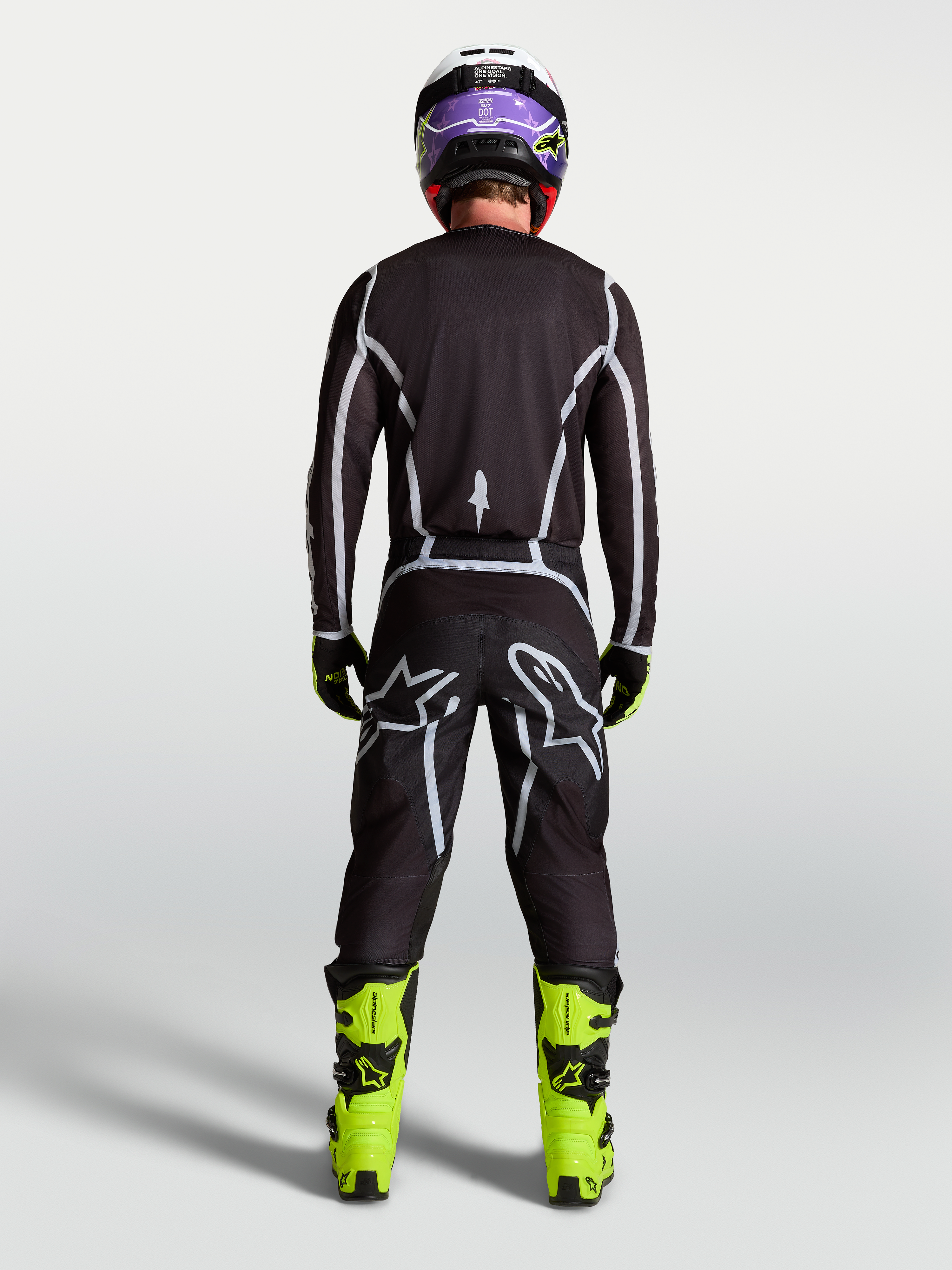 Alpinestars Fluid Apex V2 byxor, svarta och silver motocrossbyxor för herr, vy bakifrån med ergonomisk sportpassform