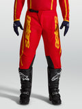Alpinestars Fluid Apex V2 byxor, röd och guld motocrossbyxa för herr med förstärkta knäpaneler för terrängkörning