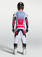 Alpinestars Fluid Drag byxor, motocrossbyxor för herrar, svart och vit med röd fluo, visas bakifrån med 3D-konstruktion.