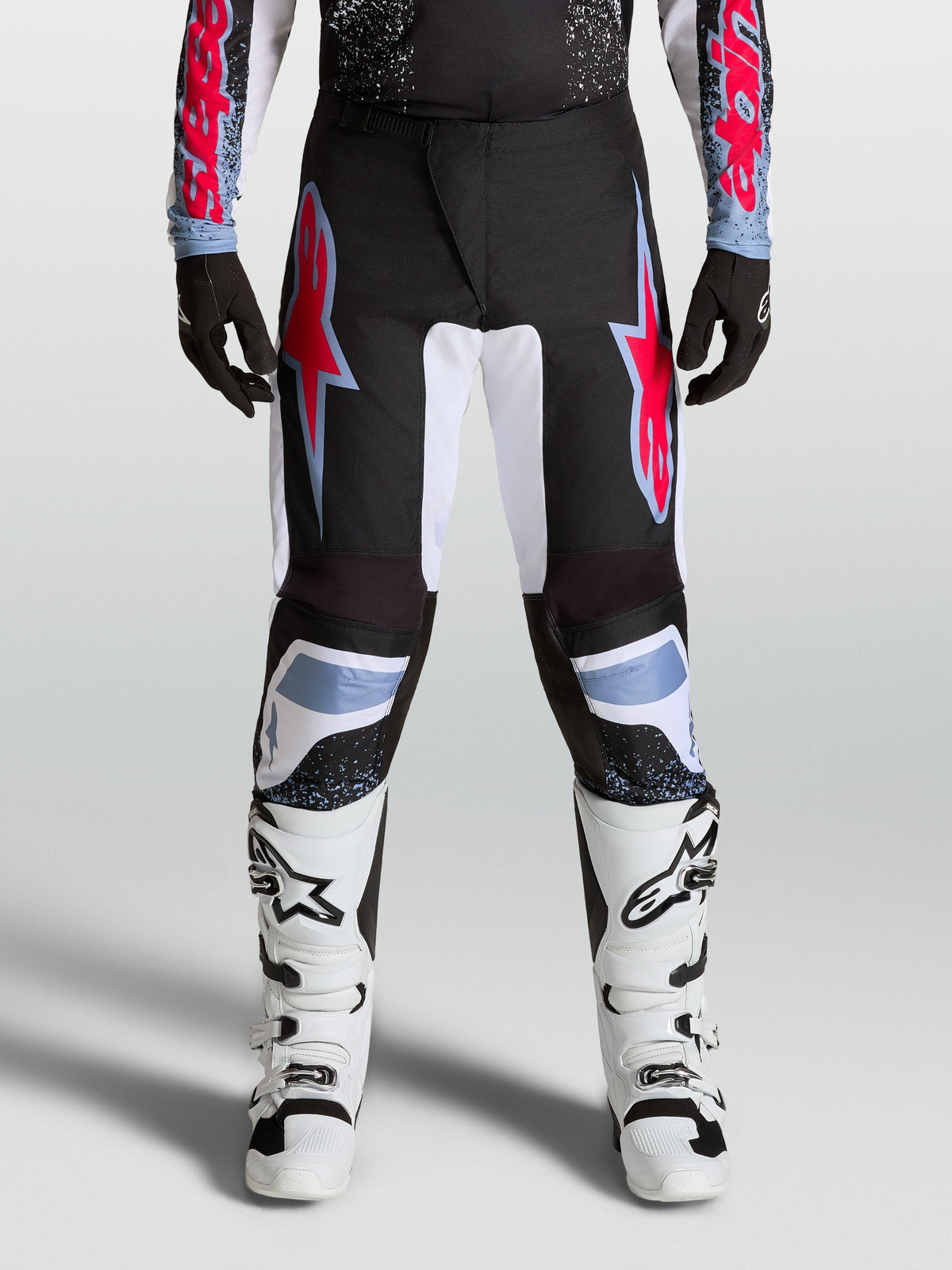 Alpinestars Fluid Drag Pants, Men's Black and Red Motocross Pants with durable 600D polyfabric and reinforced stretch panels.