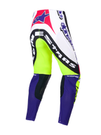 Alpinestars Begränsad Upplaga Supertech Dirt Studios byxor, motocrossbyxor, vita, lila och gula, enskikts stretch-ripstop med läderknäpaneler, bakifrån som visar märkets grafik