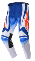 Alpinestars 2023 Racer Semi-byxor, motocrossbyxor, blå, vita och starkt orangea, med stora orangea stjärnlogotyper, svarta värmebeständiga innerpaneler vid knäna och en förböjd ergonomisk design för prestanda vid terrängkörning.