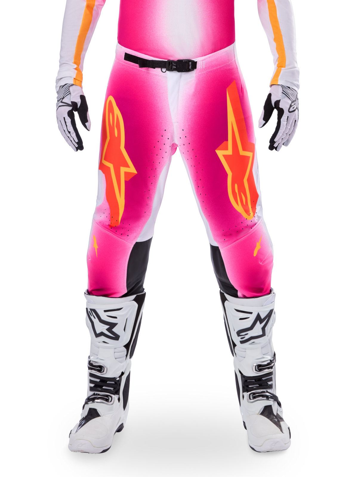 Alpinestars Limited Edition Supertech AFD MIG Pants, Motocross Racing Pants, Pink Fluo and White with Orange accents, featuring large star logos on the thighs, perforated panels, and black knee grip zones, worn with white and black motocross boots